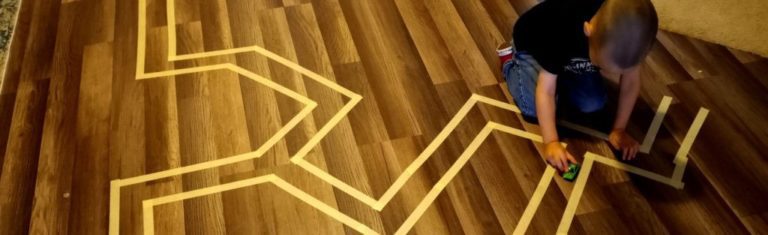 Child playing on the wooden floor